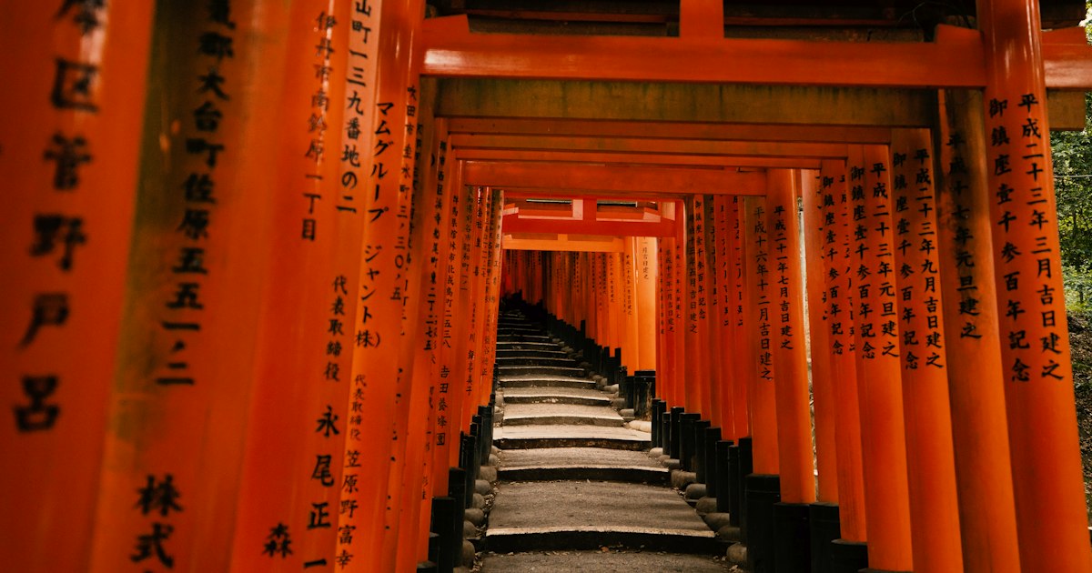 Tunnel of red torii gates at a Japanese shrine